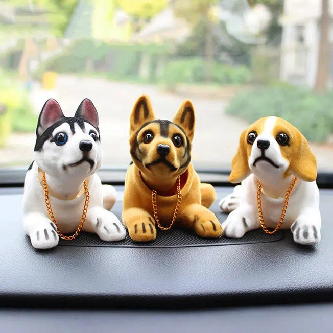 Add charm to your car interior with this Cute Shaking Head Dog Ornament. The nodding dog sits on your dashboard, bringing a playful touch to your vehicle
