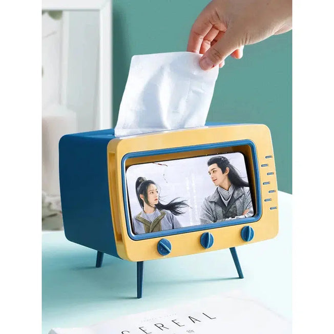 Elevated and Fun: Cartoon TV Tissue Box with Non-Slip Base, Wear-Resistant Design, and a Handy Card Slot for Mobile Phone Placement.