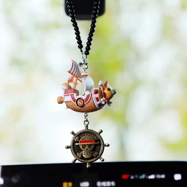 Decorate your car with the iconic Pirates' Boat models, the Going Merry and Thousand Sunny, as adorable action figure pendants. These cartoon collectible toys add a playful touch to your vehicle.